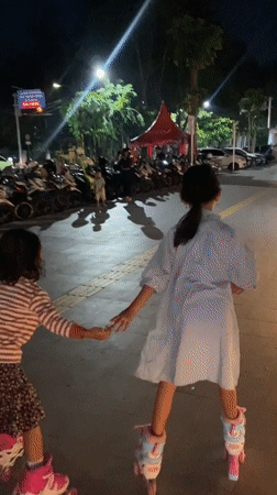Evening family recreation at Sidoarjo public square features roller skating