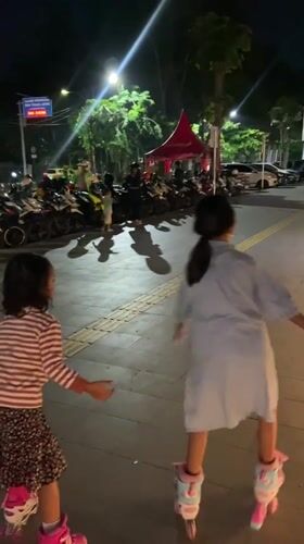 Evening family recreation at Sidoarjo public square features roller skating