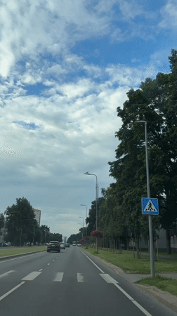 Roads, cyclists, a parked Kawasaki, and green apples