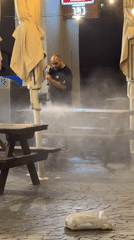 Late-night beach scene: cleanup, gymnastics, and socializing in Tel Aviv