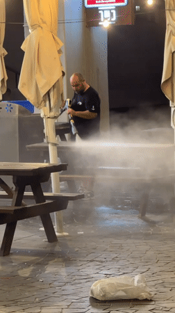 Late-night beach scene: cleanup, gymnastics, and socializing in Tel Aviv