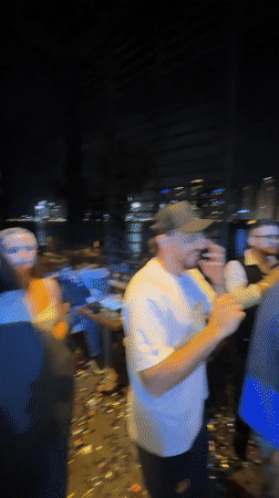 Nighttime celebration with dancing and confetti at Dubai karaoke lounge