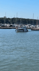 Tallinn harbor buzzing with boats and jet skis on a summer afternoon