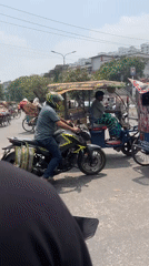 Morning rickshaw traffic observed in busy Dhaka street
