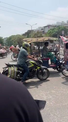 Morning rickshaw traffic observed in busy Dhaka street