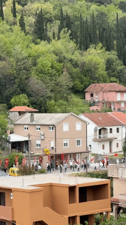 Flag-bearing procession draws crowds in Zelenika village, Montenegro