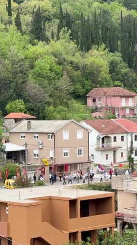 Flag-bearing procession draws crowds in Zelenika village, Montenegro
