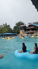 Packed waterpark day in Baru, Indonesia, inner tubes everywhere