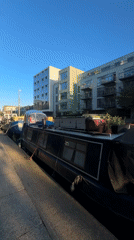 Sunny canal scene with narrowboats captured in London