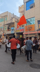 Ganesh procession rolls through Puttaparthi with drums, color, and crowds