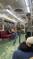 Girl performs with microphone on Buenos Aires train