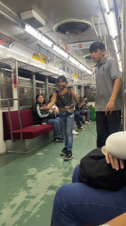 Girl performs with microphone on Buenos Aires train