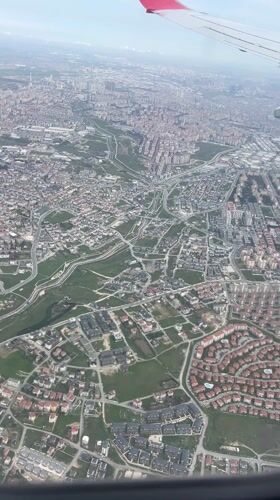 Aerial view captures Turkish urban landscape from airplane window