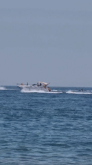 Boats and paddleboards on the Mediterranean near Castelló d'Empúries