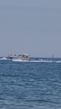 Boats and paddleboards on the Mediterranean near Castelló d'Empúries