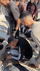 Injured man receives assistance from group in Gaza