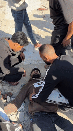 Injured man receives assistance from group in Gaza