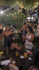 Young adults gather at outdoor North Kuta bar