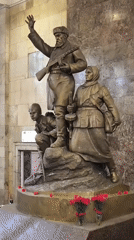 Soviet wartime sculptures inside a Moscow Metro station