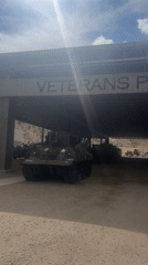 Vintage military vehicles displayed at Veterans Pavilion memorial