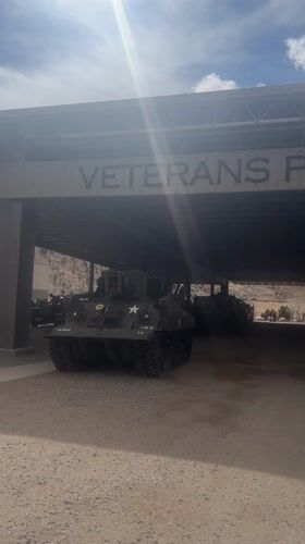 Vintage military vehicles displayed at Veterans Pavilion memorial