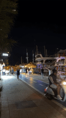 Evening harbor life continues in Turkish resort town