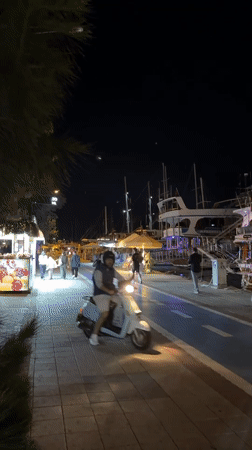 Evening harbor life continues in Turkish resort town