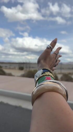 Person extends hand skyward from moving vehicle in Palm Springs