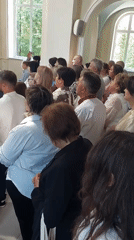 Diverse crowd gathers in apparent church setting in Ternopil