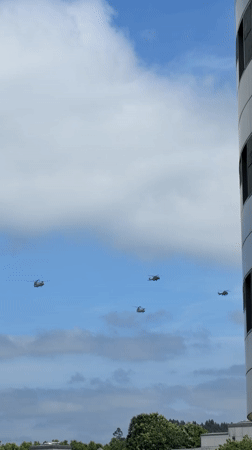 Military helicopters fly formation over Santiago de Compostela