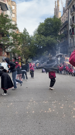 Street performers with drums and pyrotechnics draw crowds in Barcelona