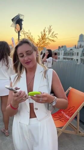 All-white outdoor event at sunset in Saratov