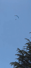 Paraglider spotted flying over Villanova, Spain in clear weather