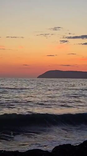 Sunset observed over ocean waters in Bar, Montenegro