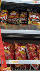 Wild Bird Found Perched in Supermarket Chip Aisle in Riga