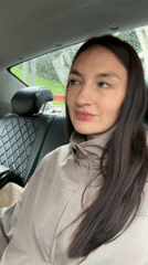 Woman talks to camera while riding in car in Sochi