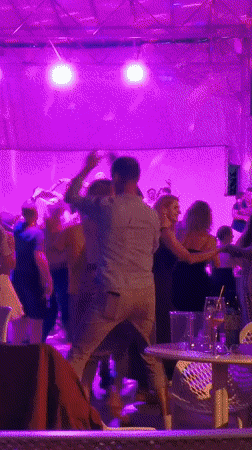 Evening dance party observed in Prague with colorful lighting