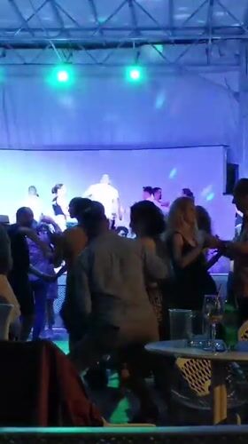 Evening dance party observed in Prague with colorful lighting