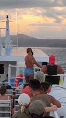 Woman in red bikini observed on boat deck in Indonesia
