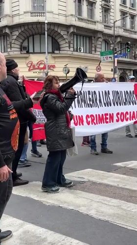 Pensioner rights protesters march through Buenos Aires crosswalk