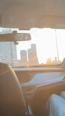 Woman travels by car in sunny Yuzhong District