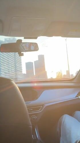 Woman travels by car in sunny Yuzhong District