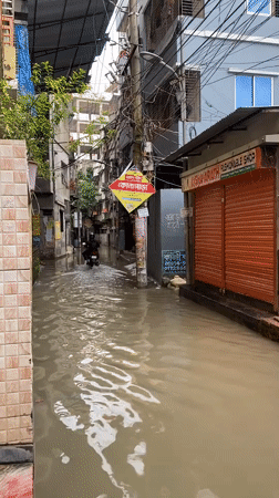 Flooding and everyday moments from a rainy day in Dhaka