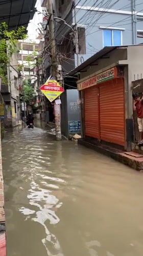 Flooding and everyday moments from a rainy day in Dhaka