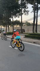 Cycling group rides through Thủ Đức streets at night