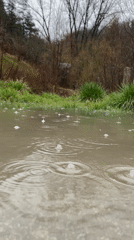 Rainfall creates ripples in puddle in Smolyan, Bulgaria