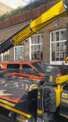 Orange van lifted onto tow truck after apparent incident in London