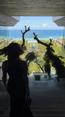 Red-haired tourist documents morning at Kempinski resort in Bali