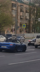Moscow street scenes captured during afternoon traffic hours