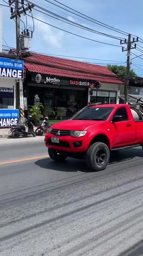 Early morning traffic flows through Baan Bo Phut streets